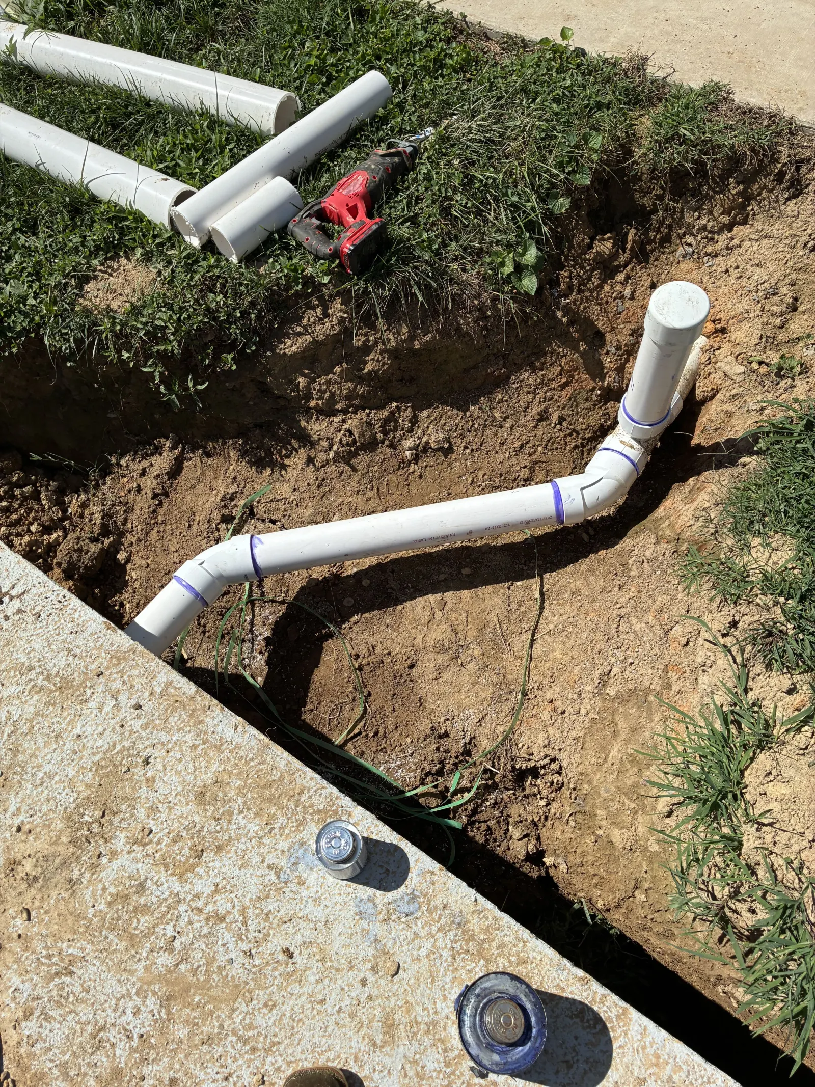 Pipe elbow connecting a new line to the septic tank
